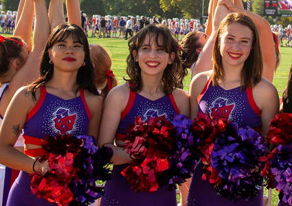 Kayley, Matigan and Olivia performing with the ѨƵ Dance Team at a Wildcat football game